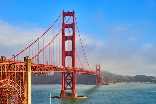 Red Golden Gate Bridge in California during vibrant foggy morning