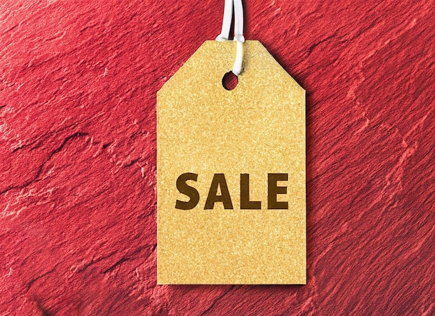 Red and golden sale tag on dark background