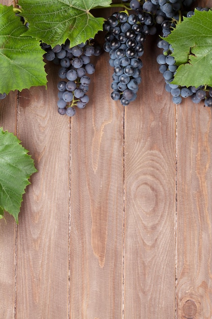 Red grape on wooden table