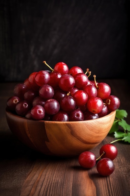 Red grapes in a bowl on a wooden table