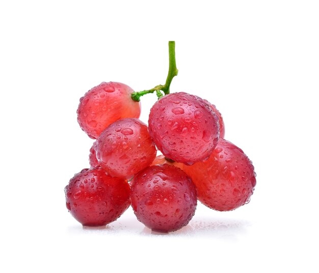 Red grapes and water drops isolated on white