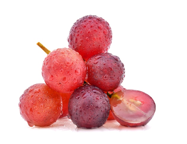 Red grapes with drop of water isolated on white background