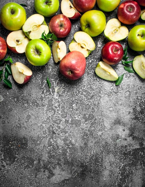 Red and green apples. On a rustic table.