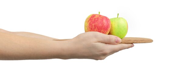 Red and green apples on wooden board in woman hands isolated on a whites background, banner photo