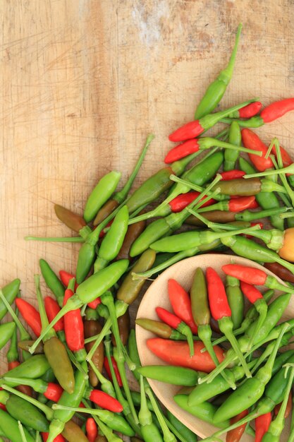 Red green and brown Chili on wood