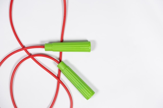 Photo red green rope on white background closeup