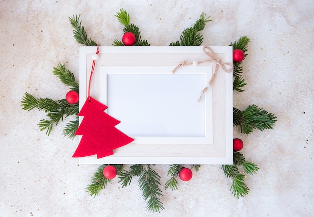 Red and green winter frame with christmas tree