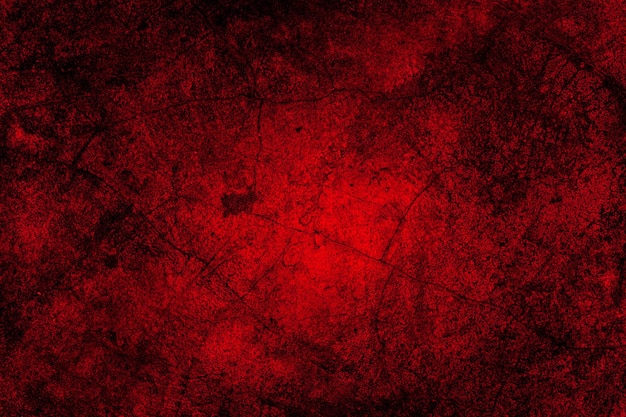 Fondo rosso di struttura di lerciume della parete dell'intonaco di cemento con crepe