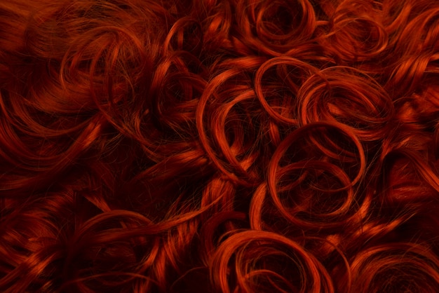 Red hair background. Curly red hair.