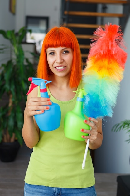 Red hair housewife cleaning her home 