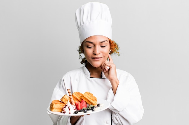 Red hair pretty chef woman cooking waffles