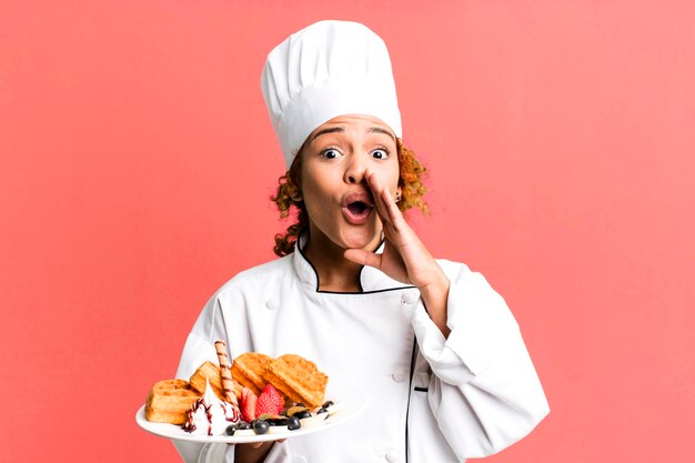 Red hair pretty chef woman cooking waffles