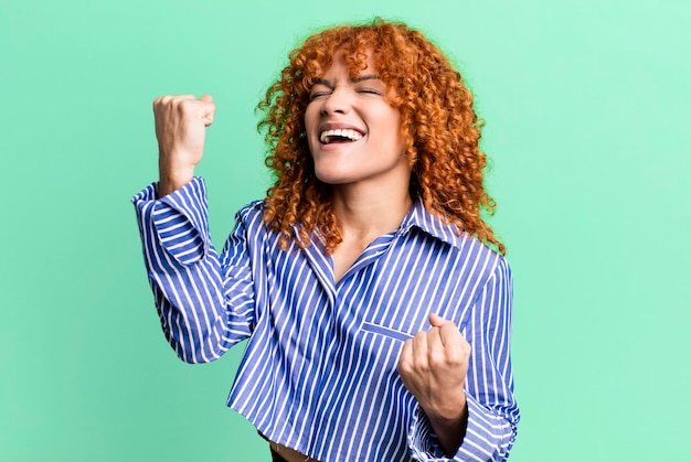 Red hair pretty woman against isolated background