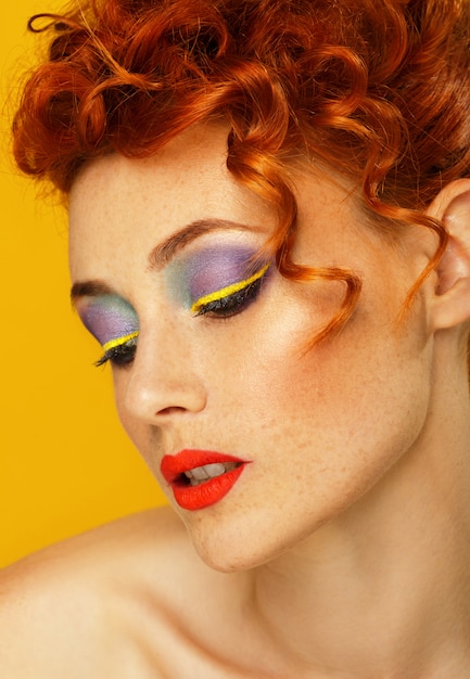 Red-haired. Beautiful girl with bright makeup