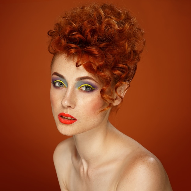 Red-haired. Beautiful girl with bright makeup