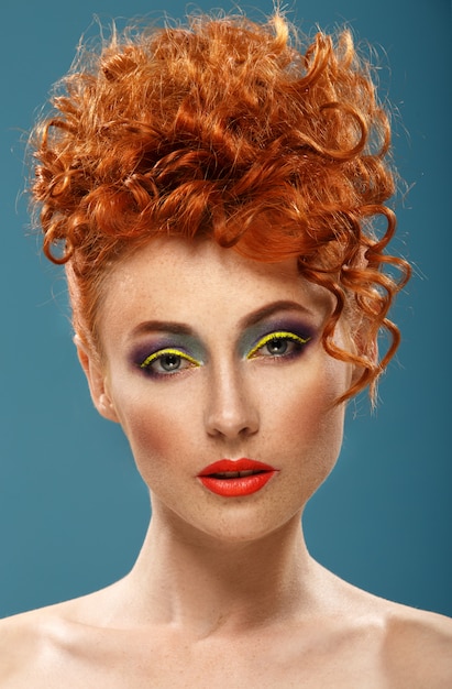 Red-haired. Beautiful girl with colour bright makeup