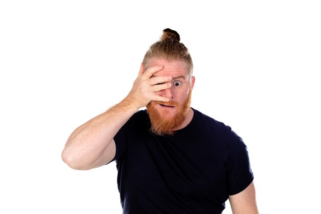 Red haired man with long beard covering his eyes