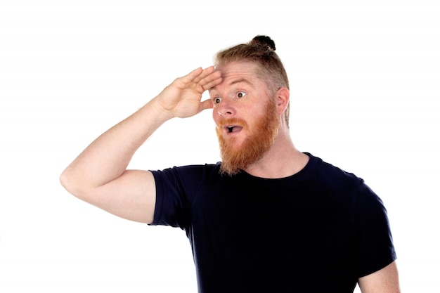 Red haired man with long beard looking out