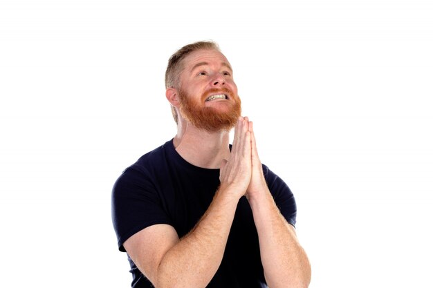 Red haired man with long beard praying