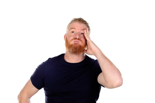 Red haired man with long beard thinking