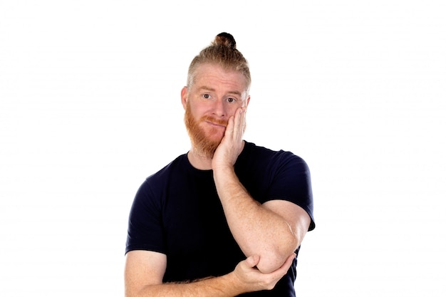 Red haired man with long beard thinking