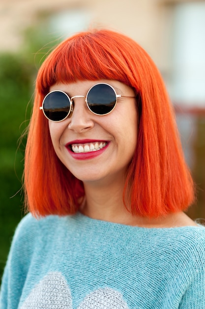 Red haired woman with cool sunglasses 