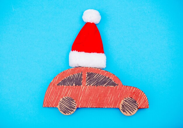 Red handmade car delivery with Christmas hat