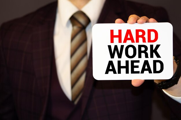 Red Hard work ahead warning sign with copy space Business concept on Hard work for successful in career