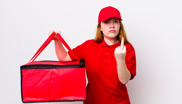 Red head pretty woman feeling angry annoyed rebellious and aggressive pizza delivery concept