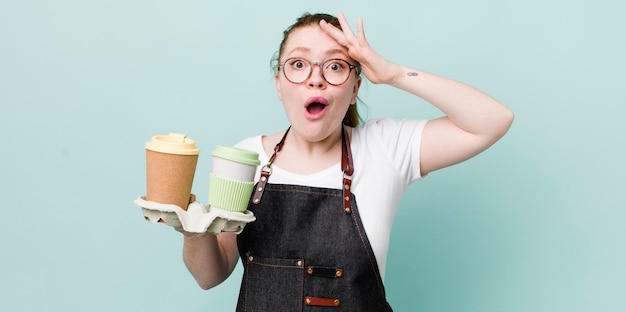 Red head pretty woman looking happy astonished and surprised take away coffee concept