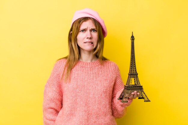 Red head pretty woman looking puzzled and confused french concept