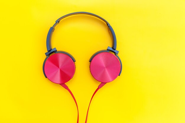 Red headphones on yellow table