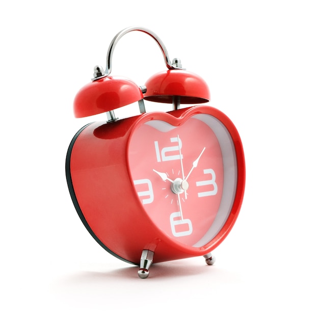 Red heart clock with bell on white background