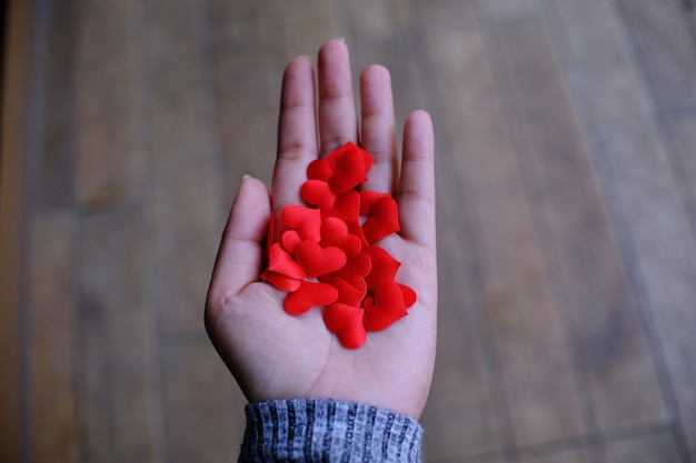 Red heart in hand