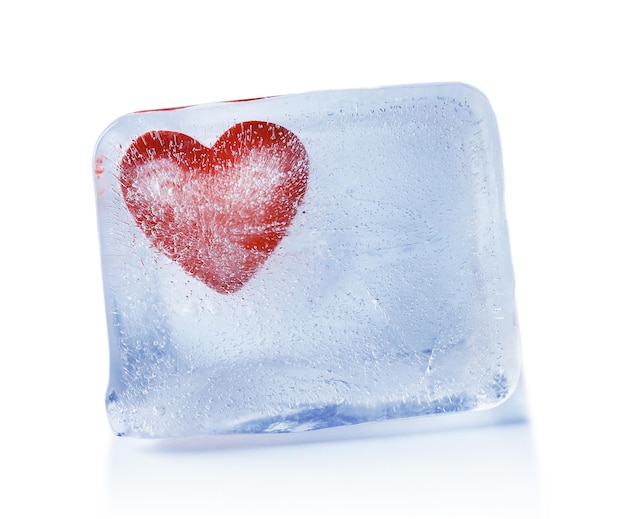 Red heart in ice cube on gray background