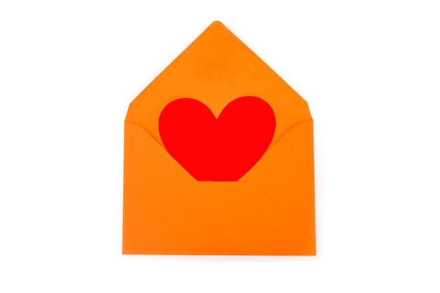 Red heart in orange envelope isolated on white