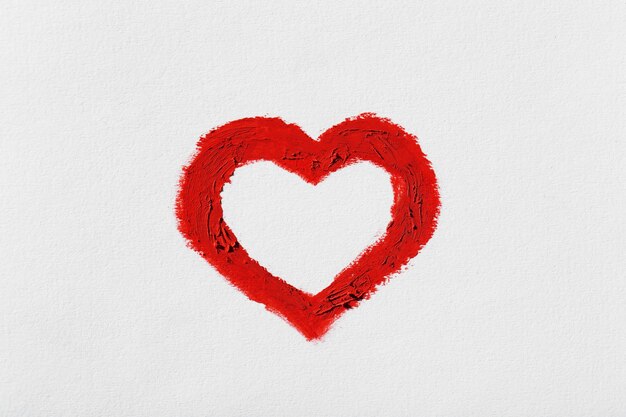 Red heart painted on light background