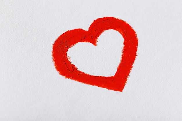Red heart painted on light background