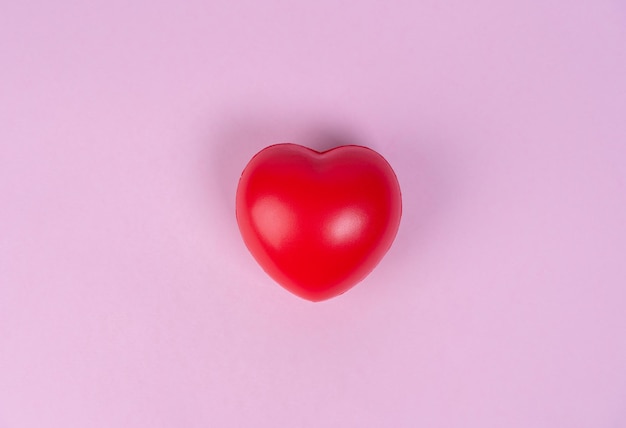 Red heart on pink background