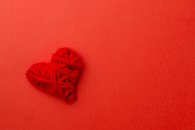 Red heart on red background. Love concept for valentines day.