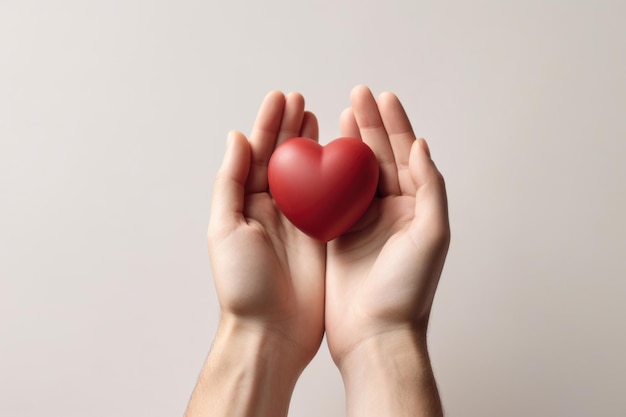 A red heart rests gently in the hands of a woman emphasizing love unity and compassion