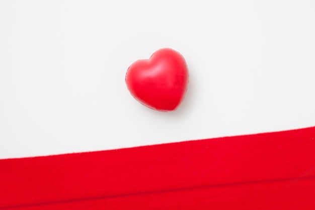 Red heart shape from above valentines day flat lay Health medicine and charity concept close up