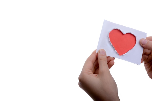 Red heart shape paper in hand