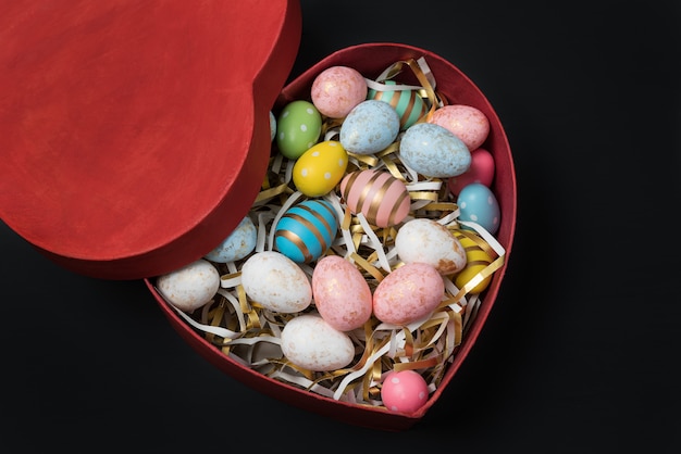 Red Heart shaped box with colorful Easter eggs