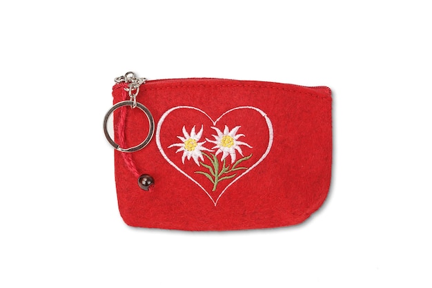 A red heart shaped pouch with a heart and flowers on it.