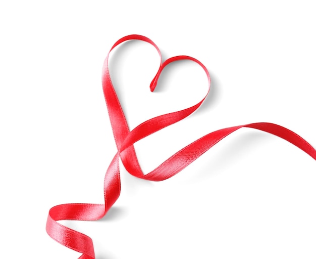 Photo red heart shaped ribbon isolated on white