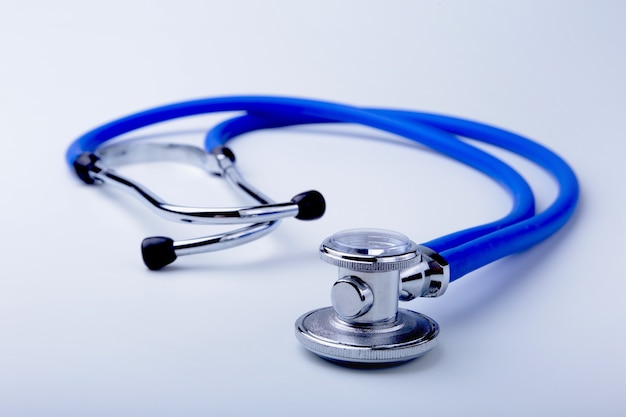 Photo red heart and a stethoscope on desk.