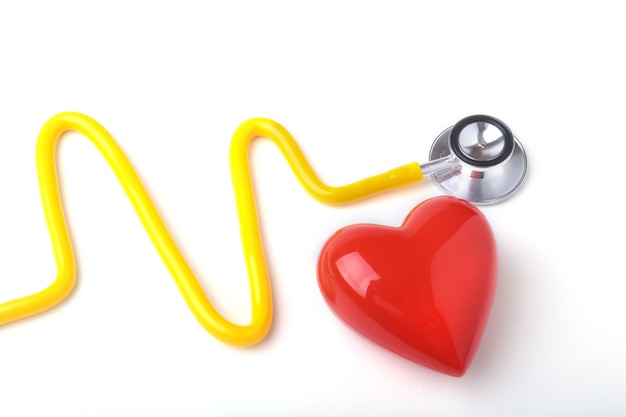 Photo red heart and a stethoscope on white background