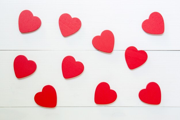 Red Heart texture pattern with love on wooden background