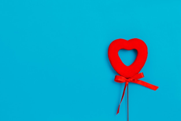 Red heart with a bow on a blue surface, Love, Valentine's Day   